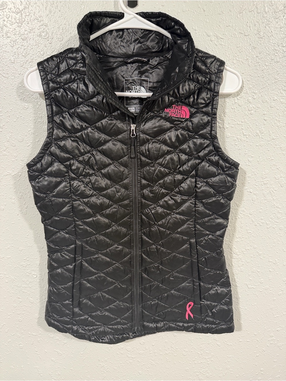 The North Face Black Quilted Vest with Pink beast cancer logo. XS